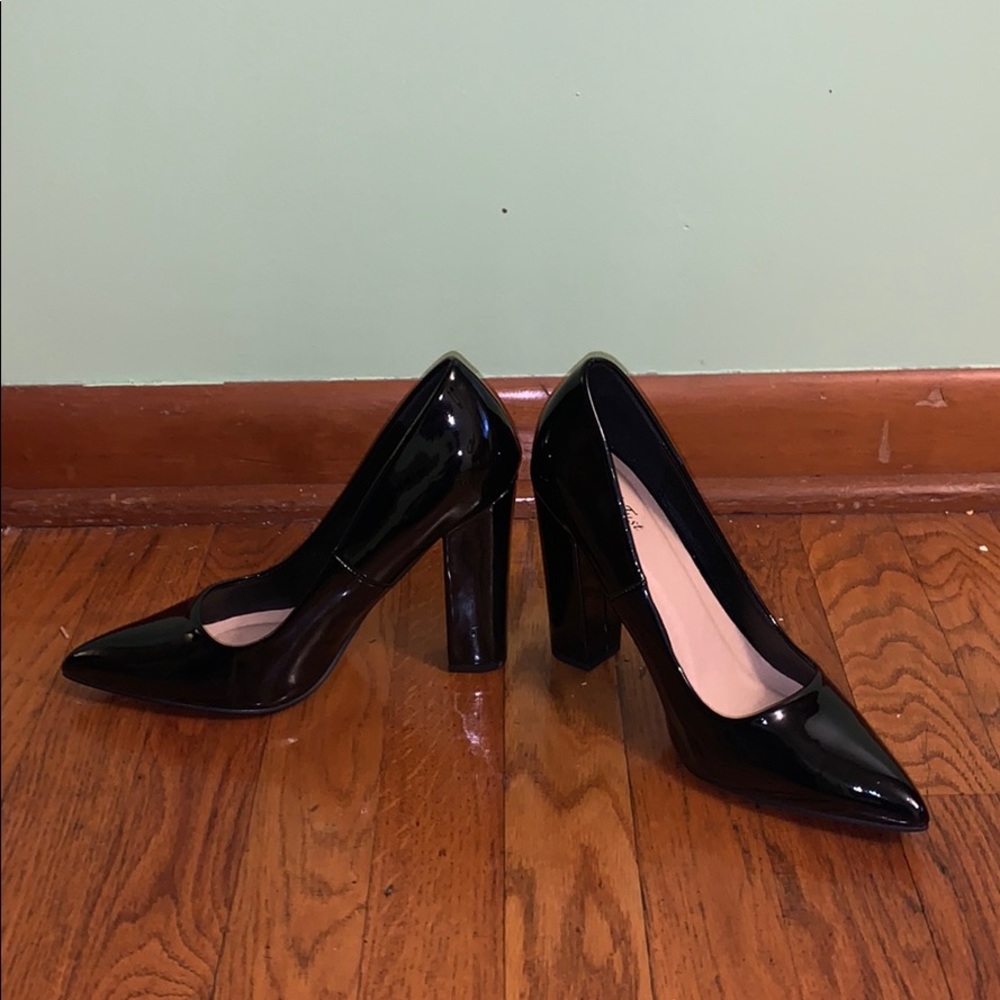 Black pointed toe high heels